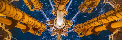 legs of an oil well going into the water
